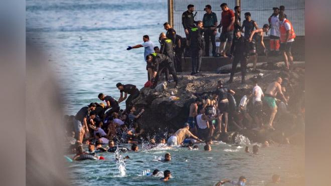 Spain sending troops as thousands enter enclave of Ceuta from Morocco