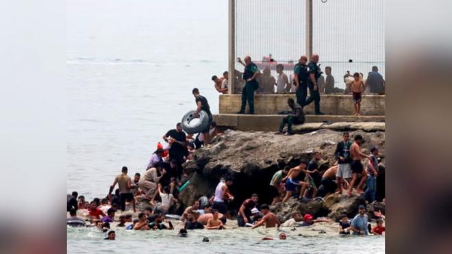 Spain sending troops as thousands enter enclave of Ceuta from Morocco